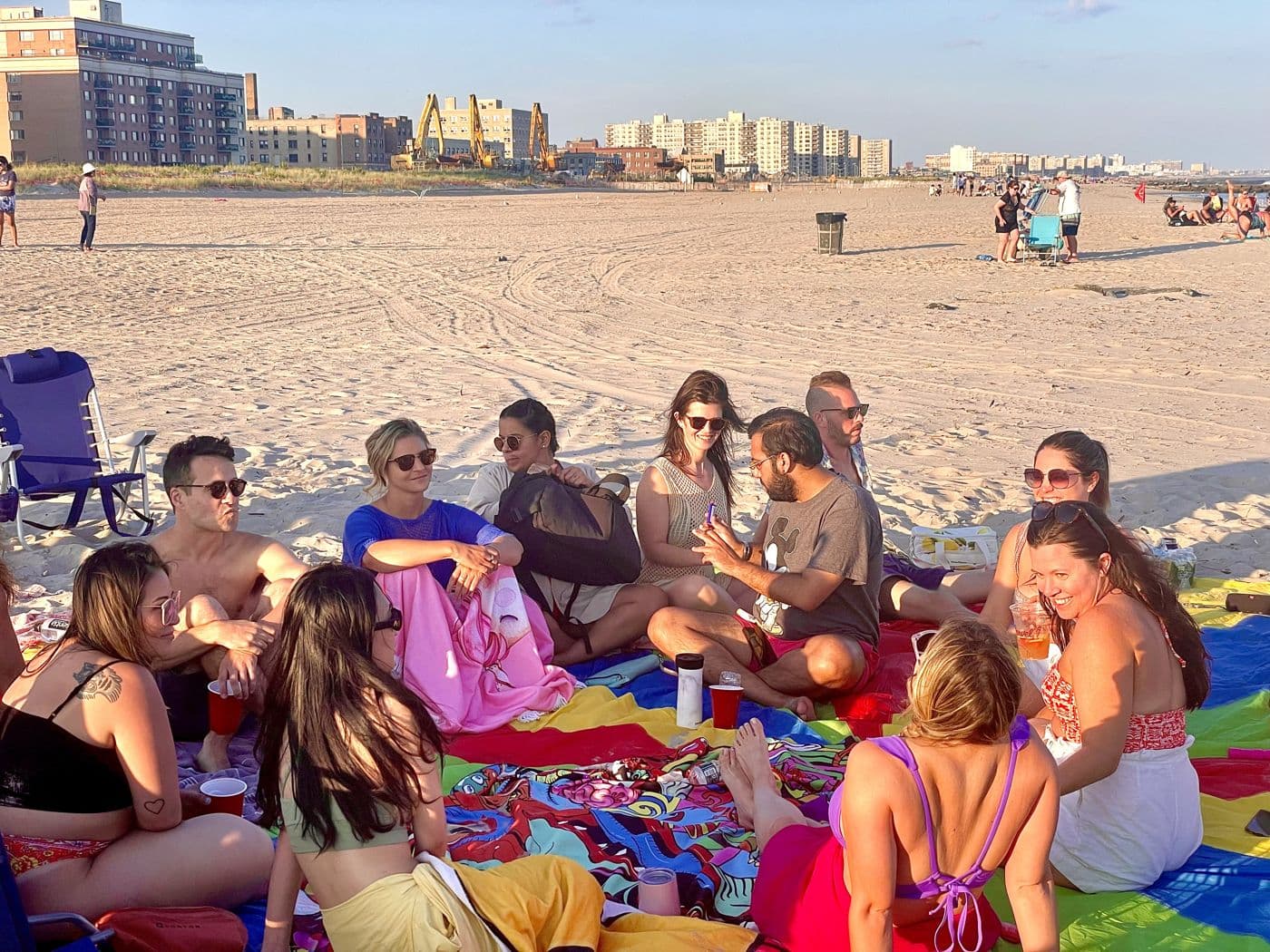 Beach picnic with the city skyline behind