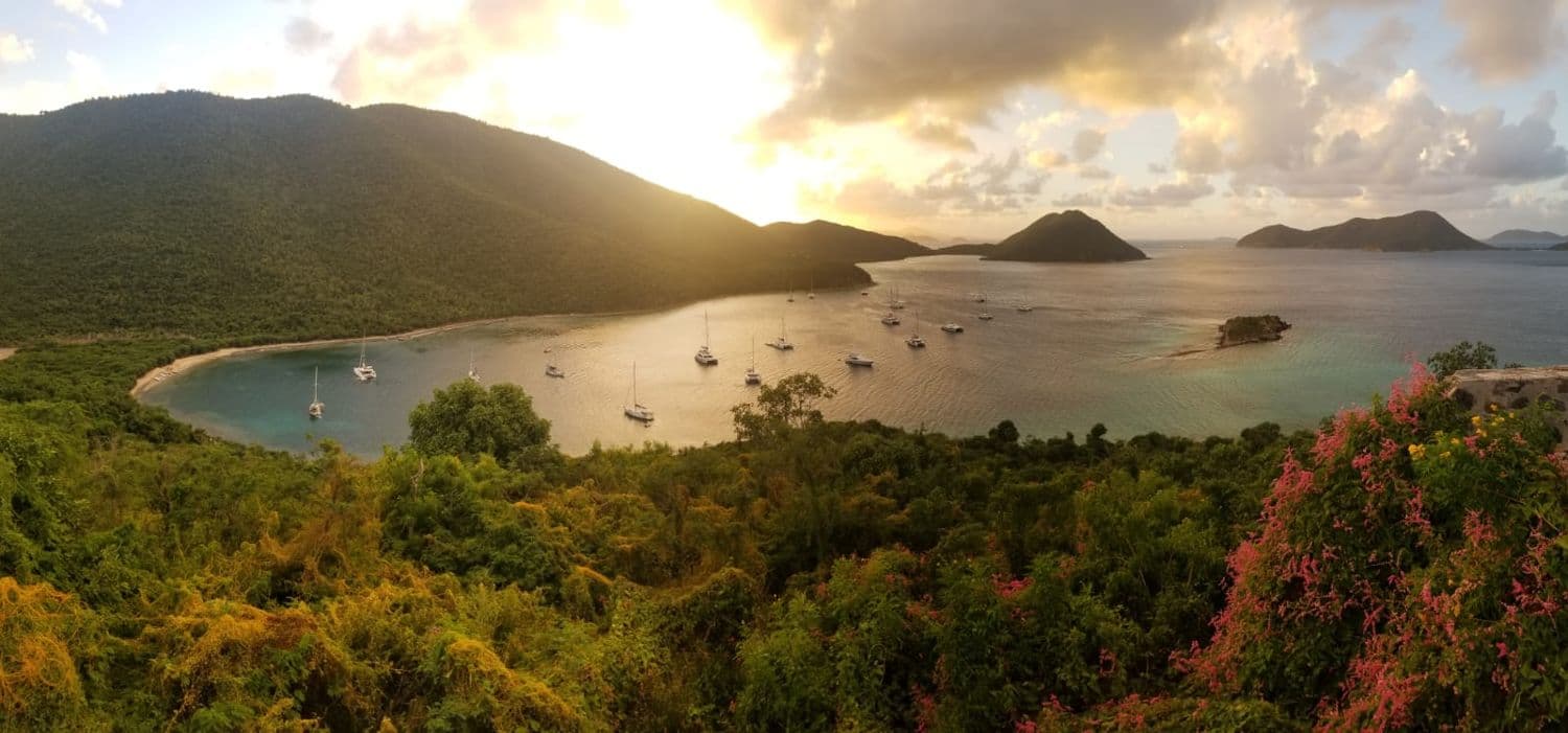 A Caribbean bay with anchored boats seen from the hillside