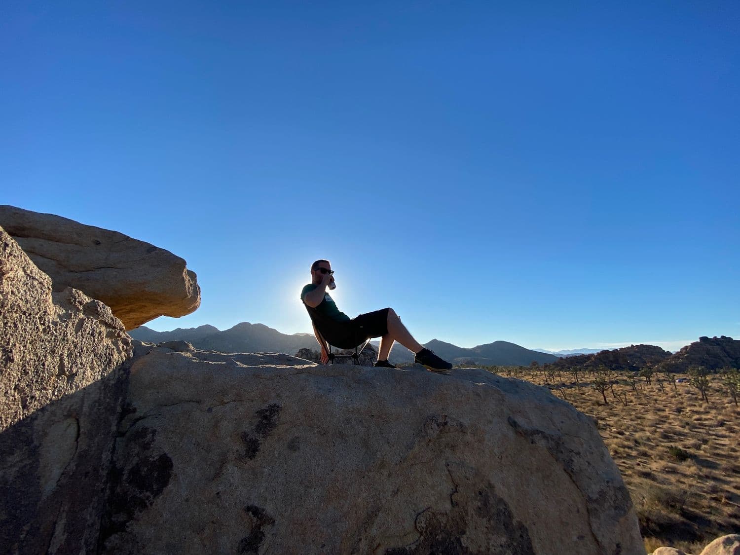 A cold one on a boulder above the desert horizon