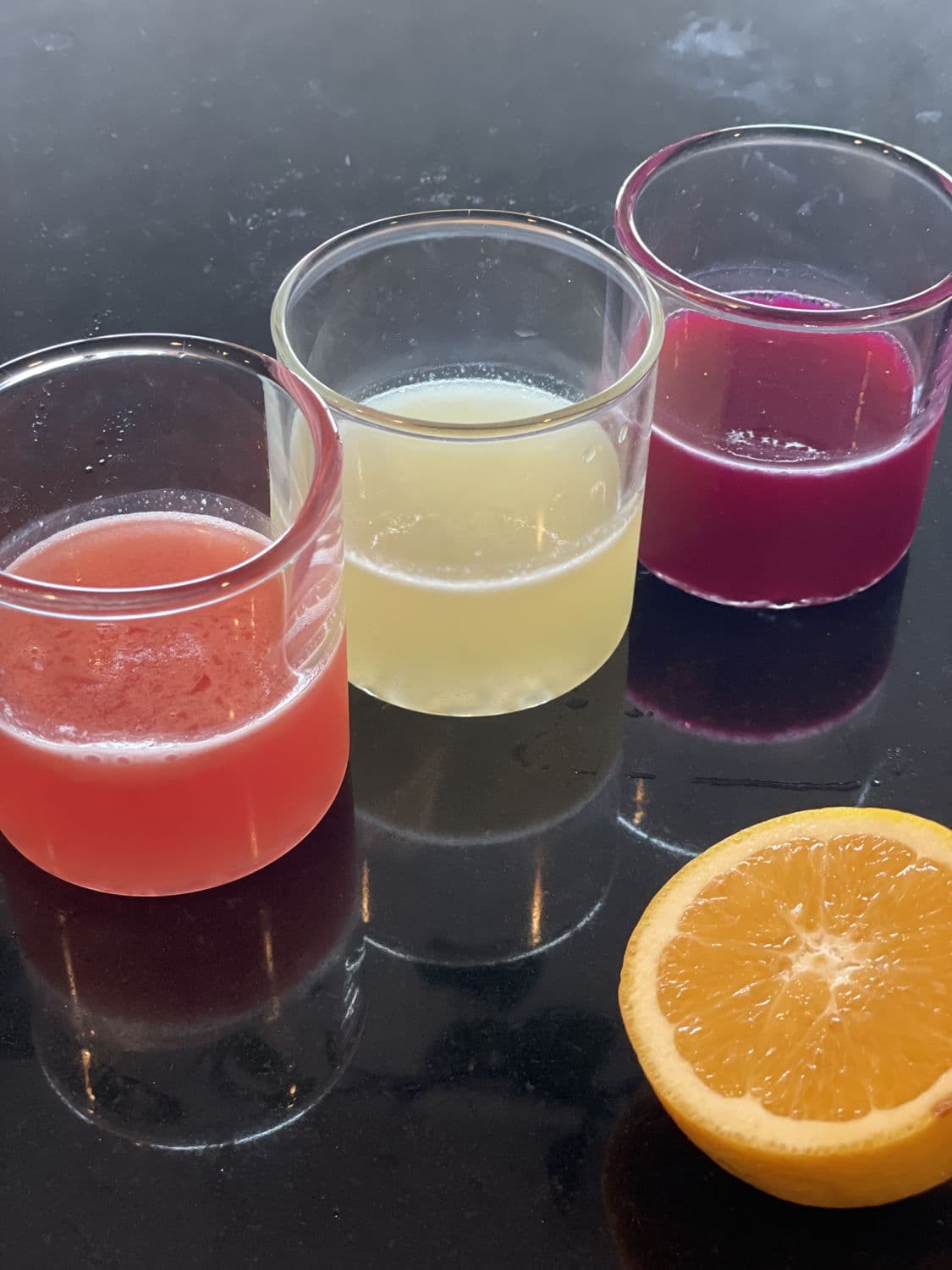 Colorful cocktail flight with citrus
