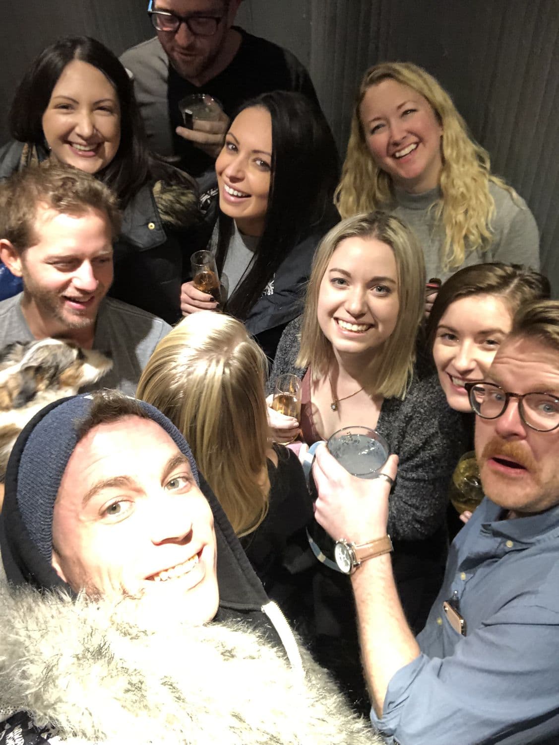 Flash selfie of the whole crew at a house party