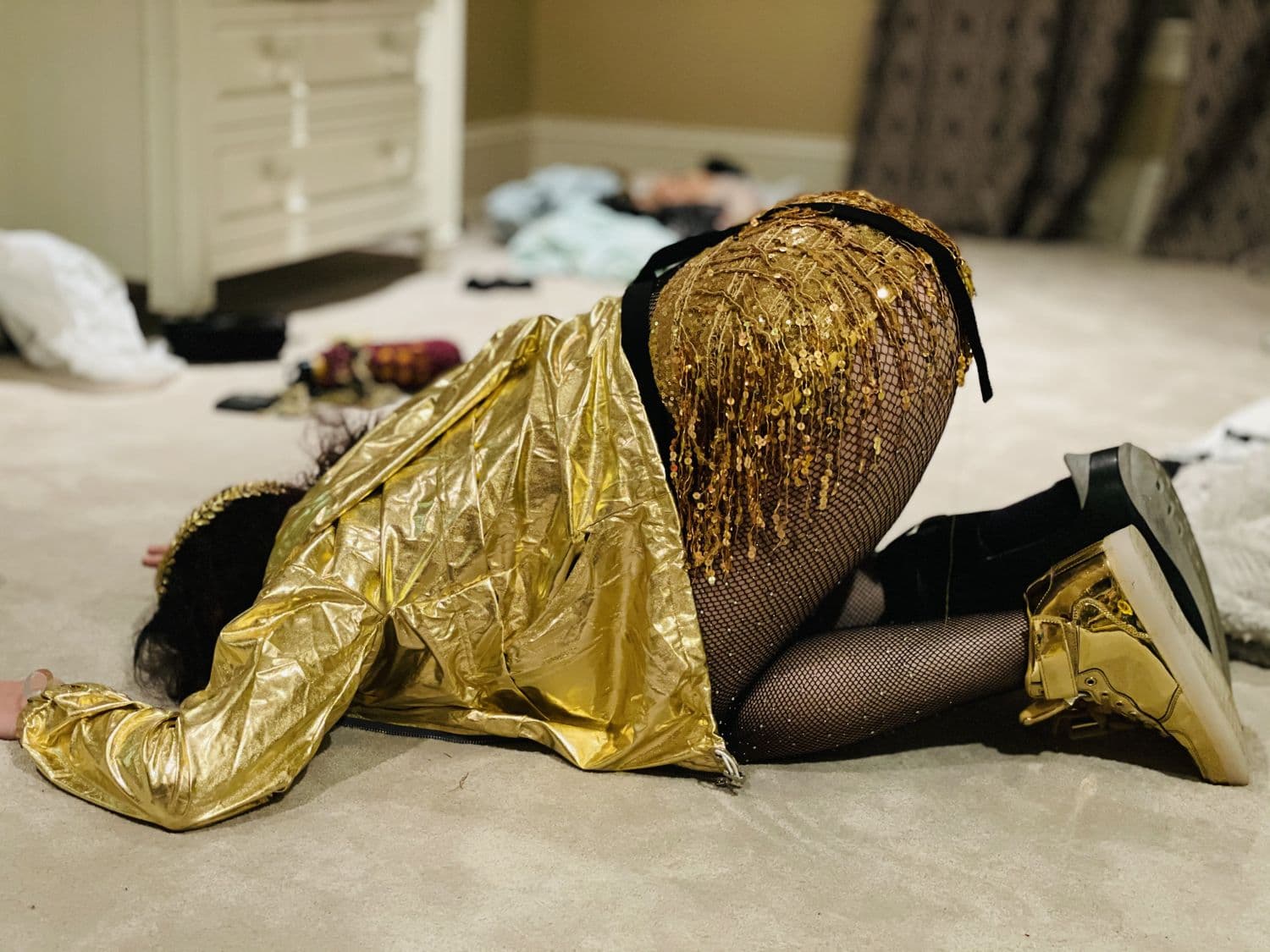 Gold sequins, sometime past midnight