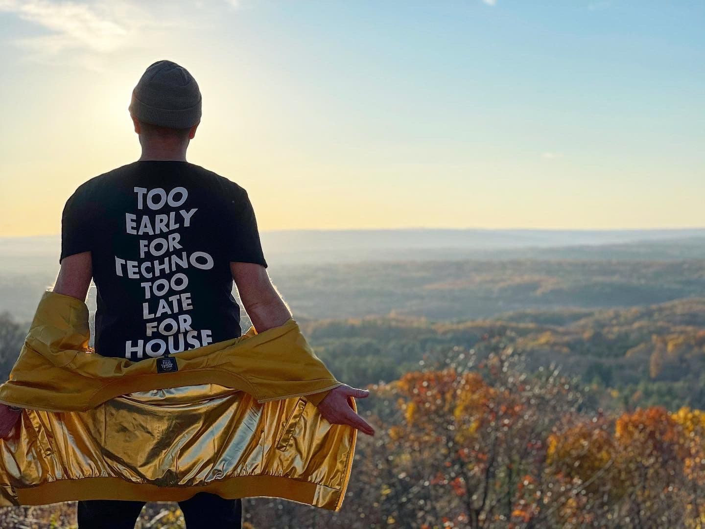 Hilltop sunset over fall foliage