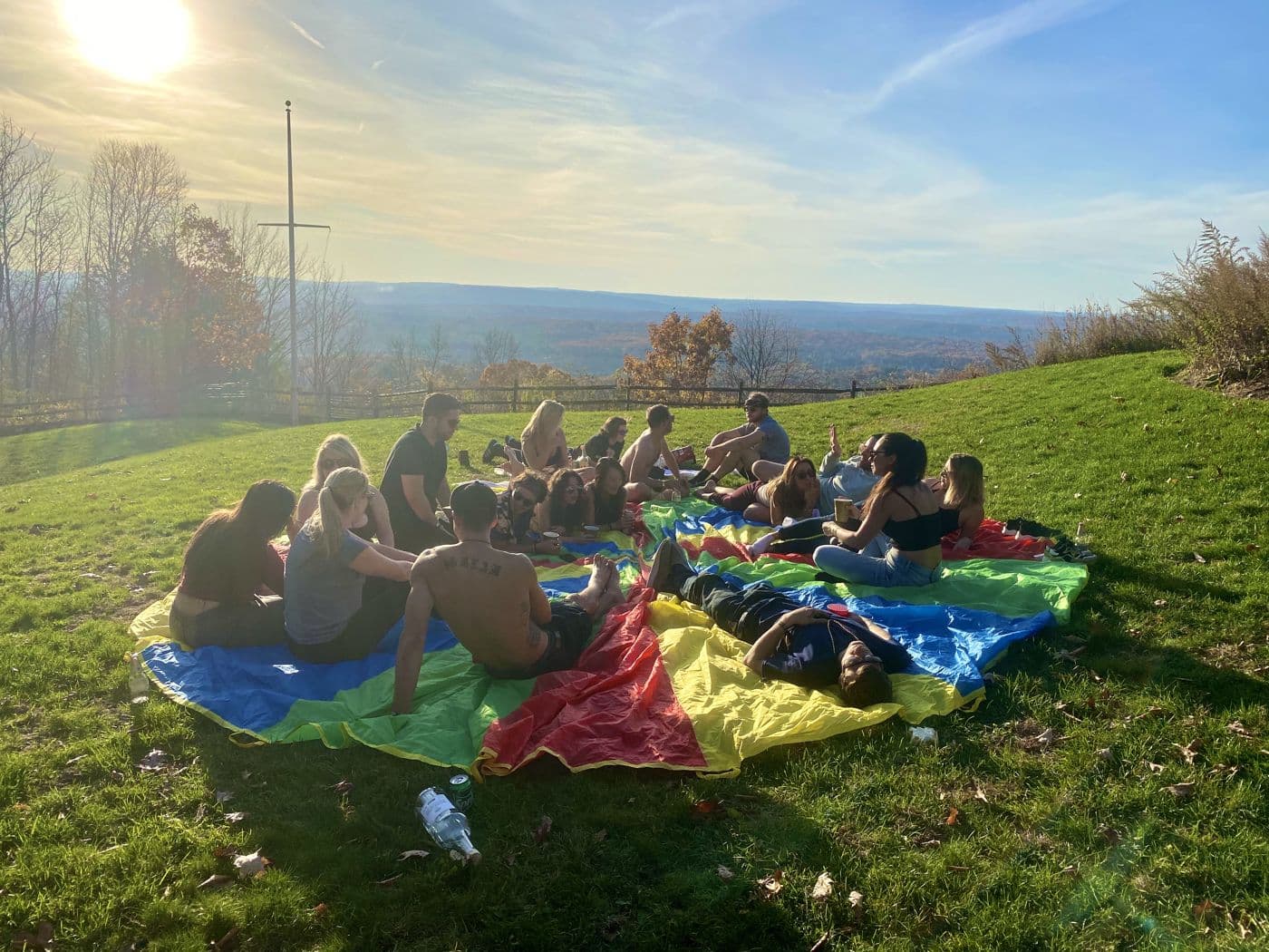 Picnic blankets on a hillside at golden hour