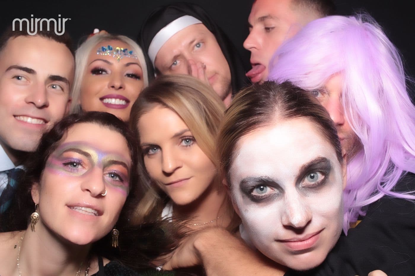Costumed friends in a photo booth