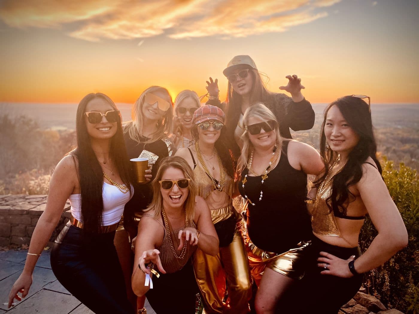 Friends on a rooftop at sunset