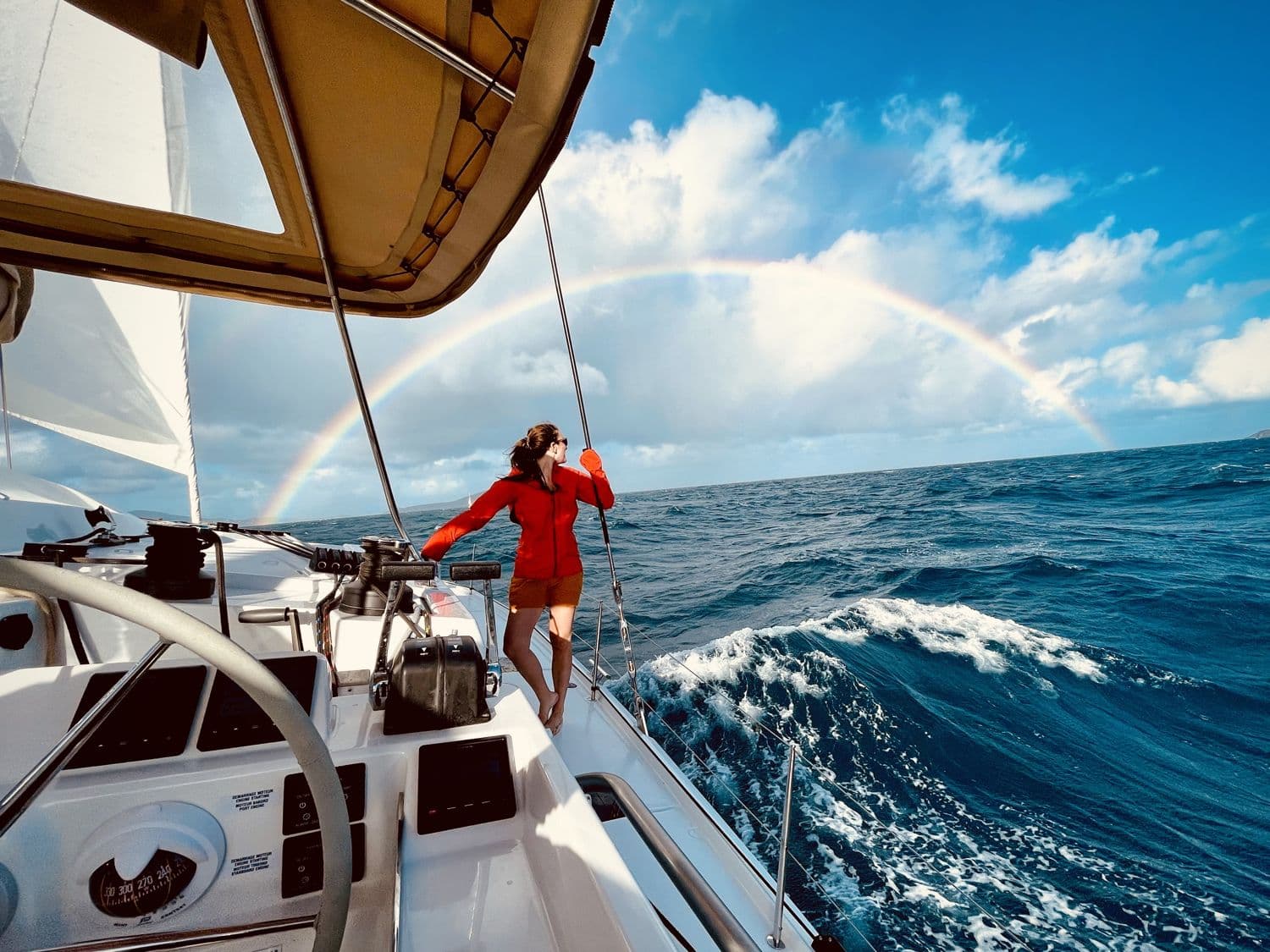 Sailing under a rainbow in open water