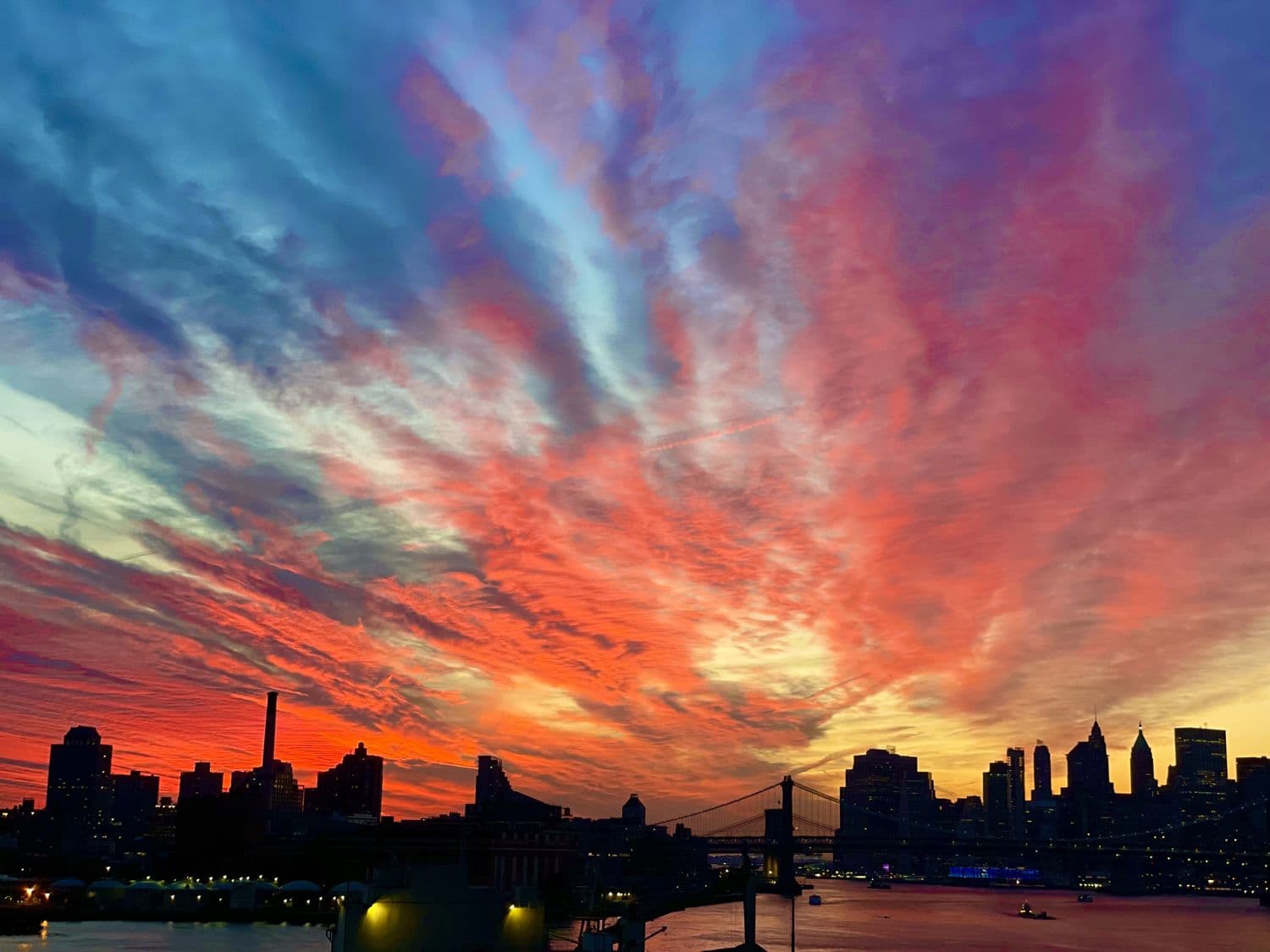The city skyline under a dramatic dusk sky