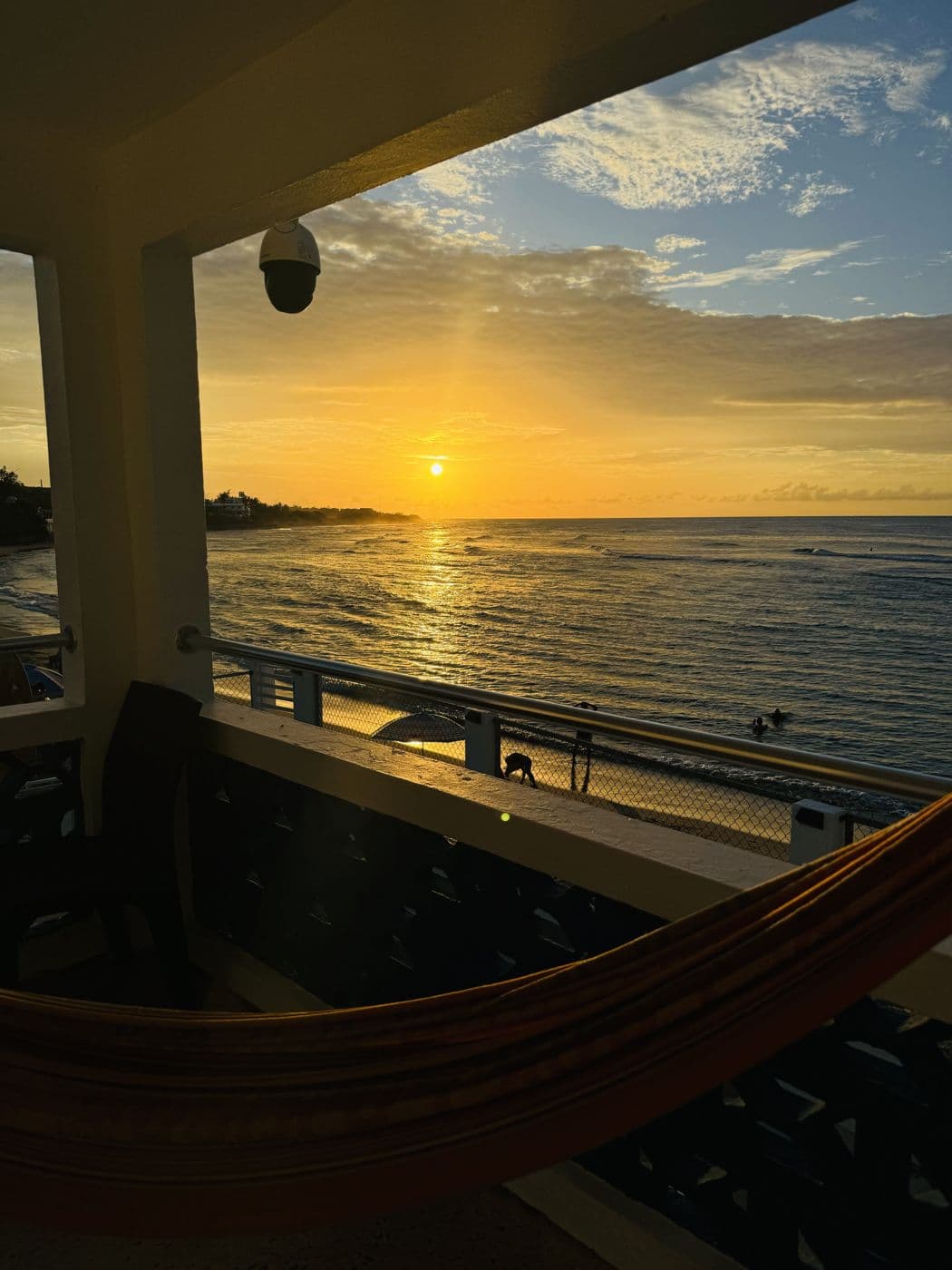 Sunset over the water from a hammock on deck