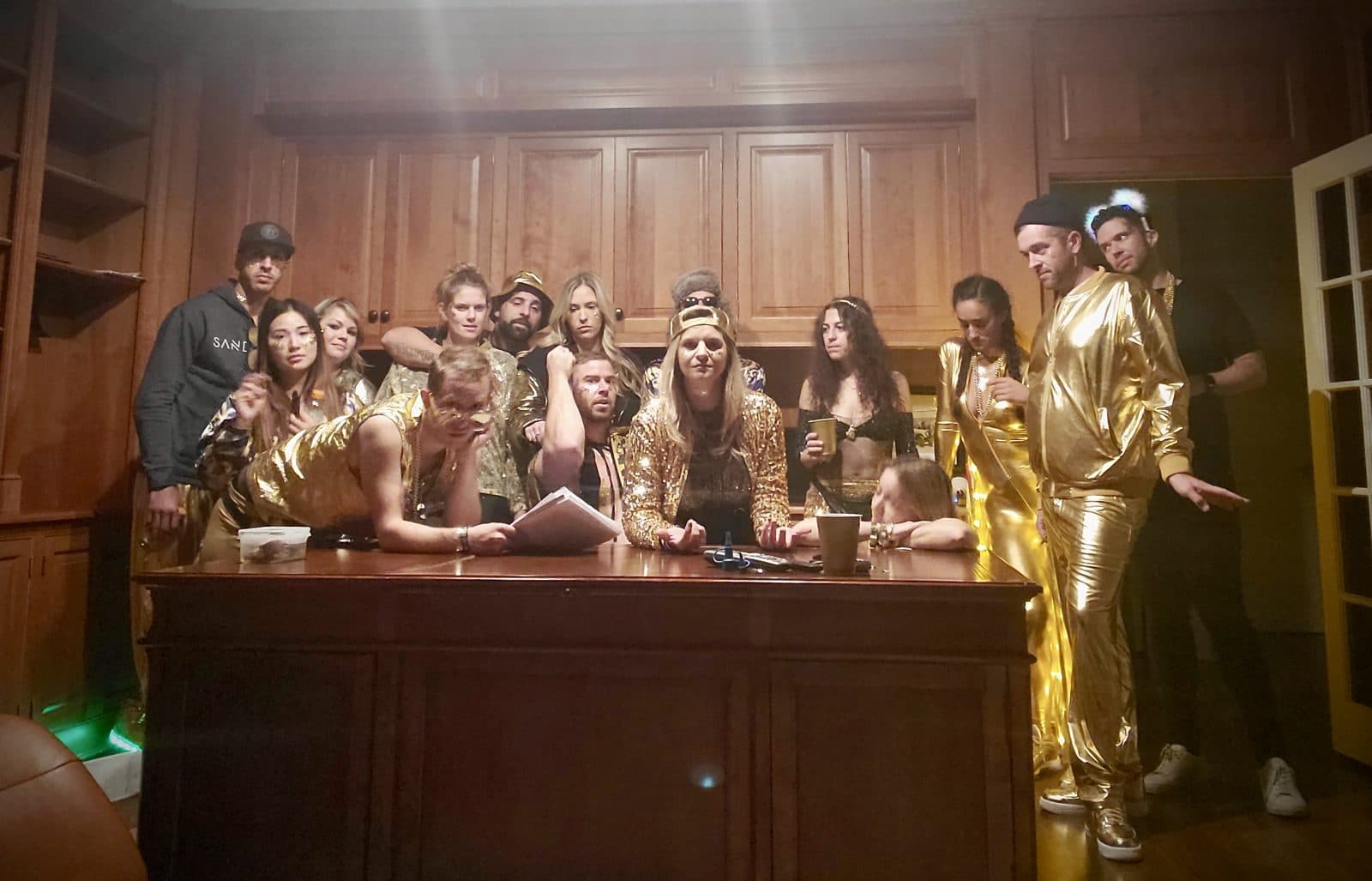 The board in gold jackets around the boardroom desk