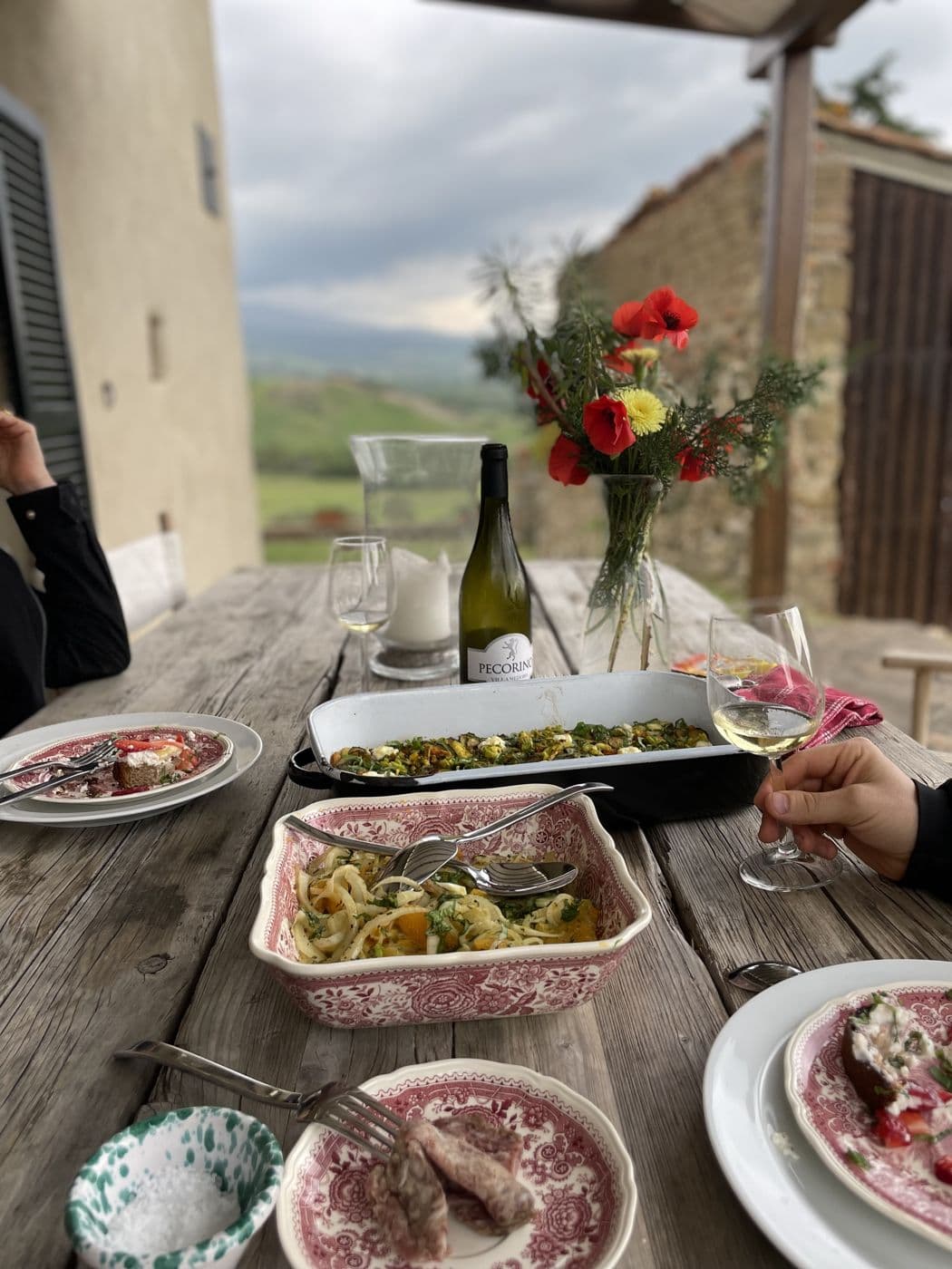 Long lunch on a stone terrace with wine