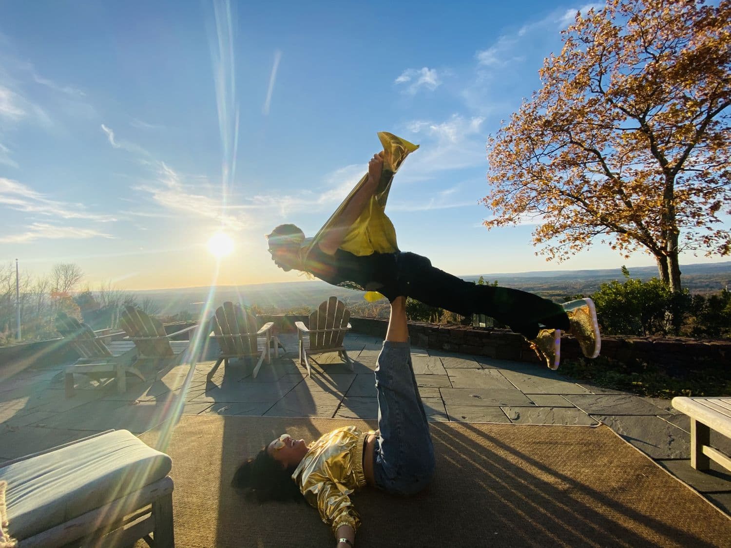 Airplane pose at golden hour on a trip
