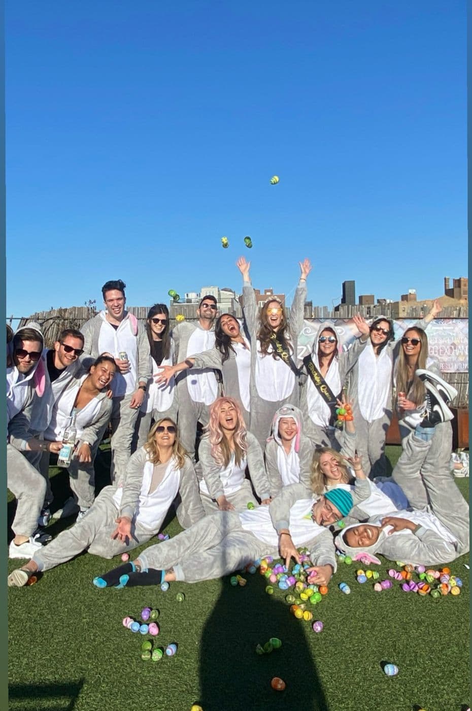 The crew in all white on the lawn