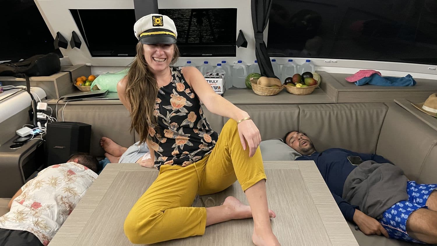 Lounging in the cabin, captain's hat on