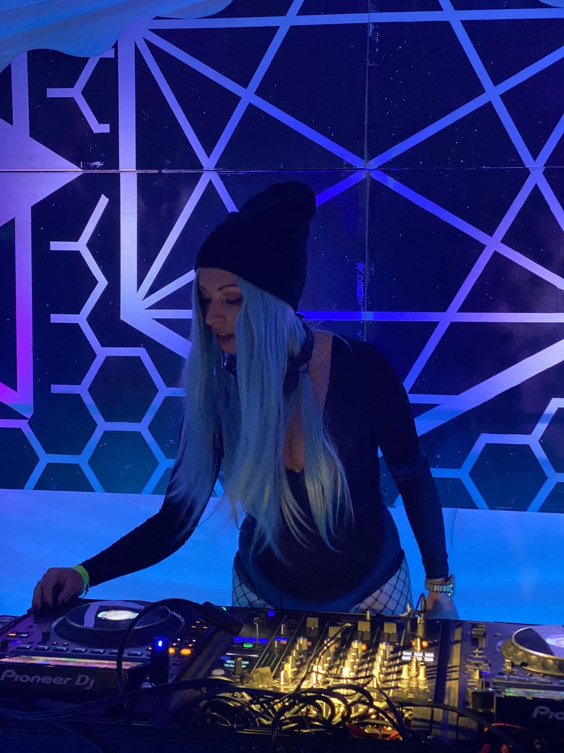 DJ booth under blue geometric light