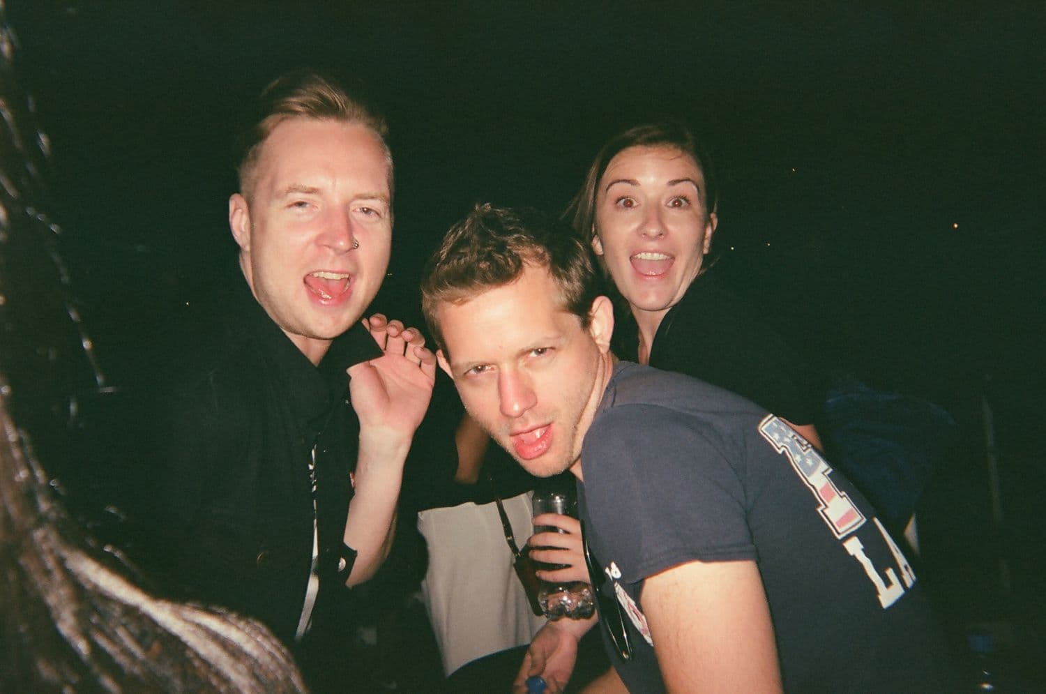 Film-flash shot of the rescue crew mid-party