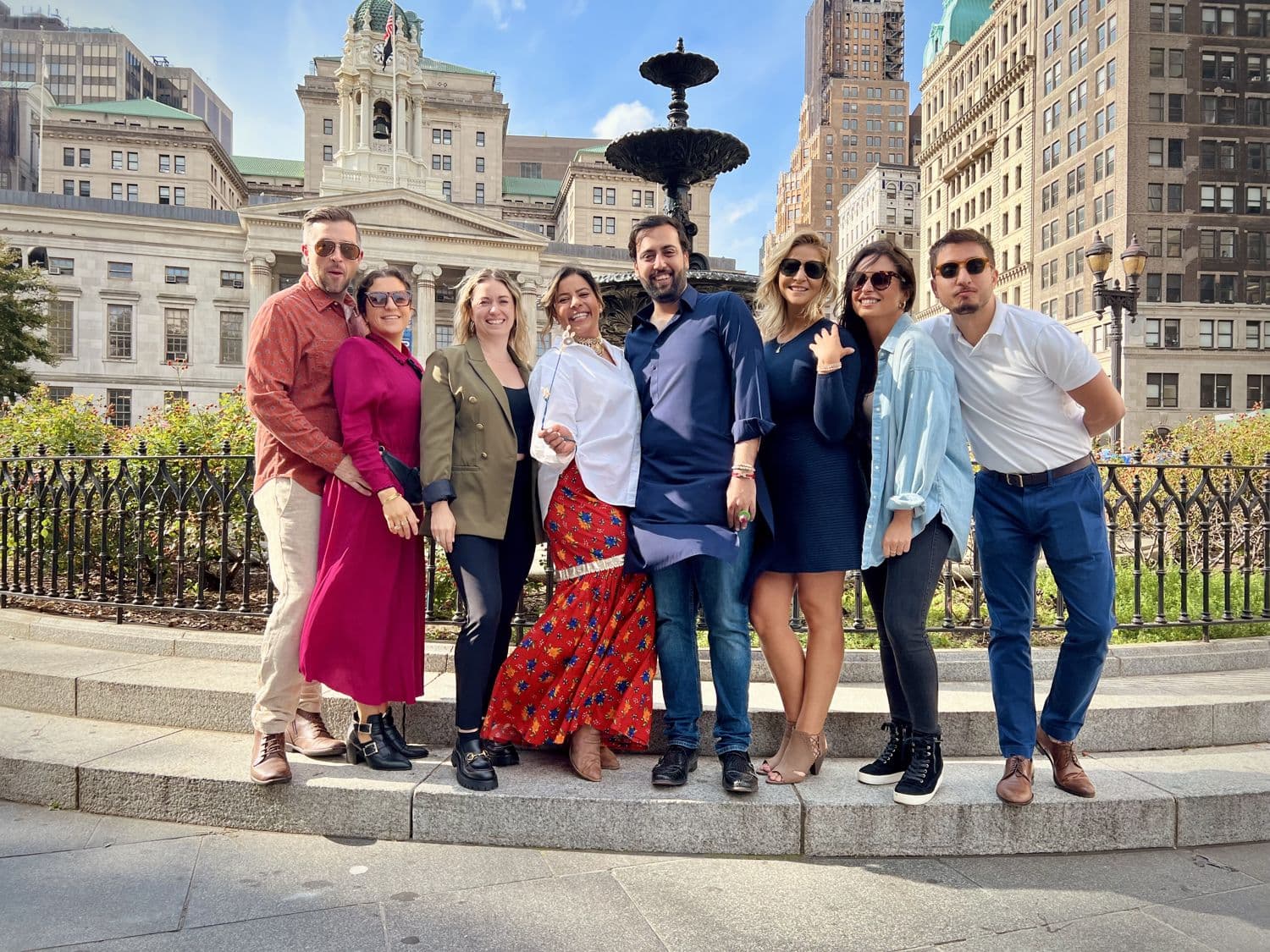 Dressed-up guests gathered at a city fountain